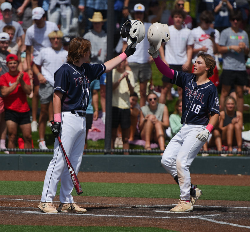 Cherokee Trail's Bowen Tabola, right, is congratulated by teammate Will Parsons after Tabola hit a late-inning home run, sealing the Cougars' 6-2, 5A playoff win over Legacy, May 27, at All Star Park in Lakewood. The Lightning face Vista Ridge at 9 a.m. Saturday, May 28, at All Star Park.